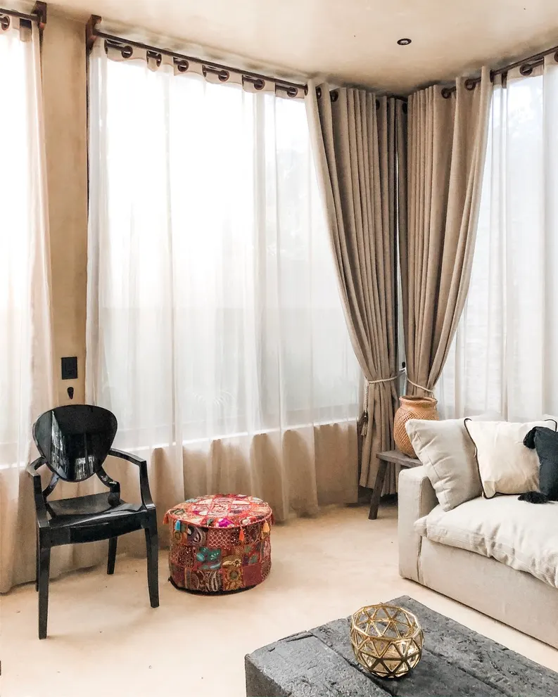 Natural light filtered through custom curtains